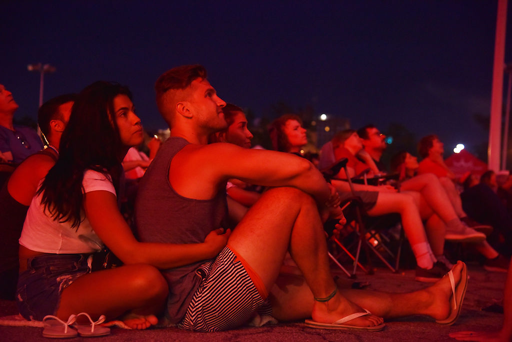 Leticia Wasson, left, and Erik Wasson watch as the fireworks are set off during the 67th annual Fire in the Sky celebration
